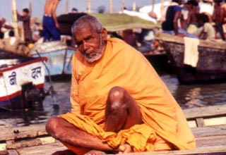 A sadhu poses obliges